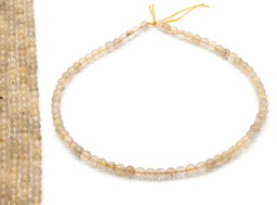 Vedere dettagli per Perline rutilate di quarzo da 6 mm a filo Immagine di Perline rutilate di quarzo da 6 mm a filo