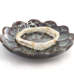 Vedere dettagli per Quarzo rutilato sfaccettato. Bracciale rondelle 4x3mm  Immagine di Quarzo rutilato sfaccettato. Bracciale rondelle 4x3mm