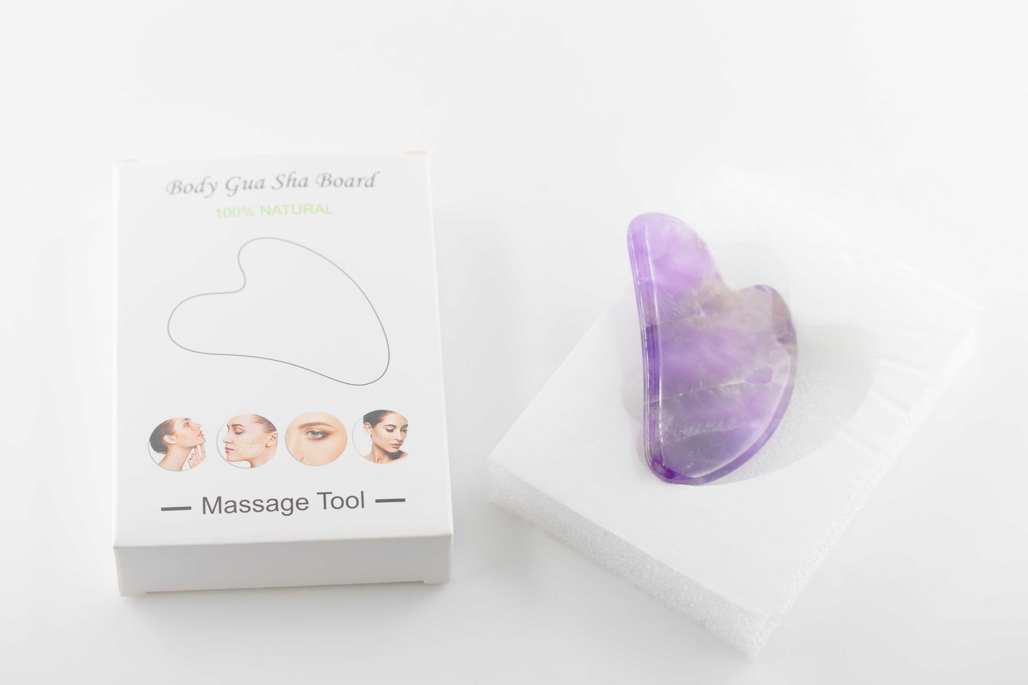 Bild von Amethyst Guasha Massage Form 8x5cm, mit Box