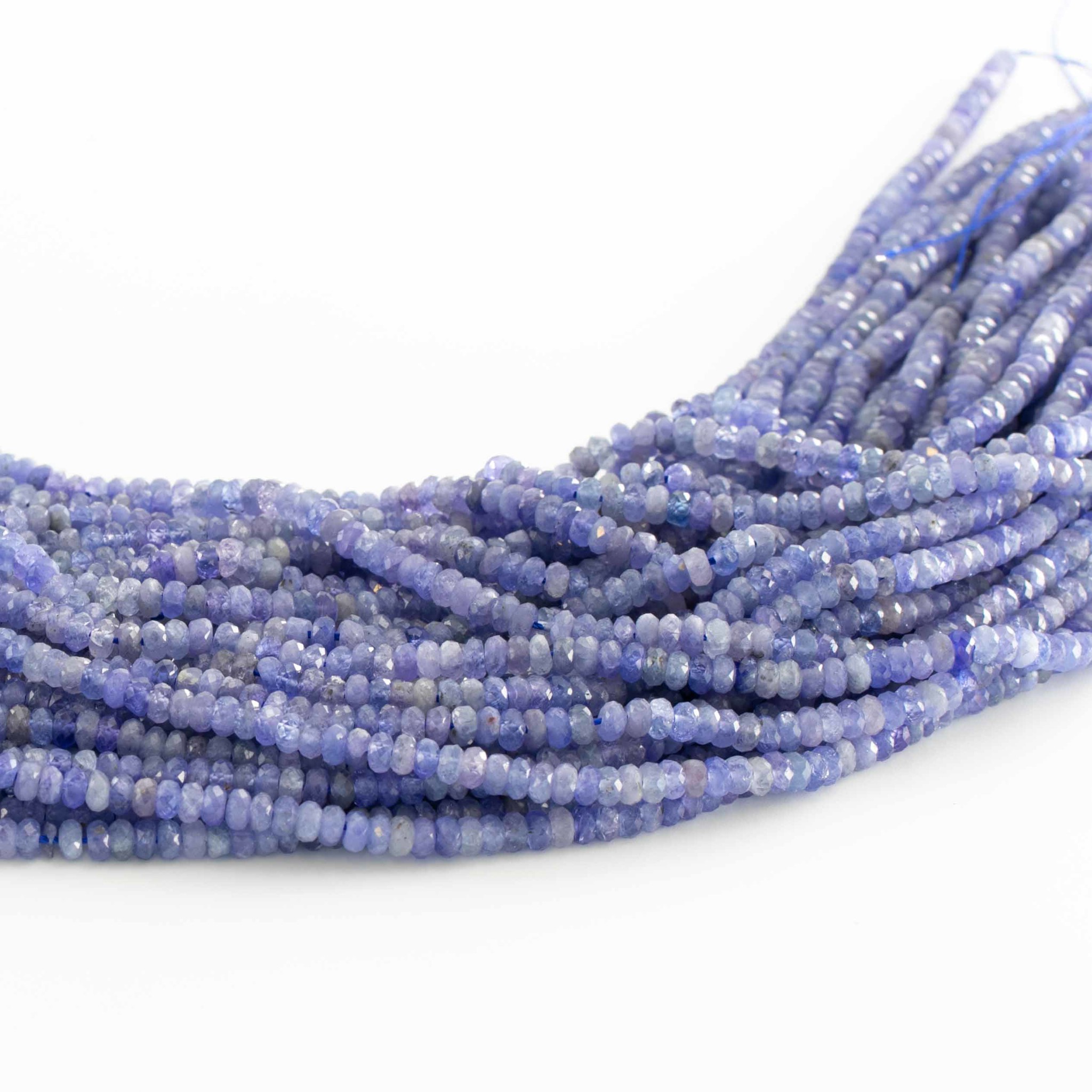 Tanzanit fac. Button  4mm Strang