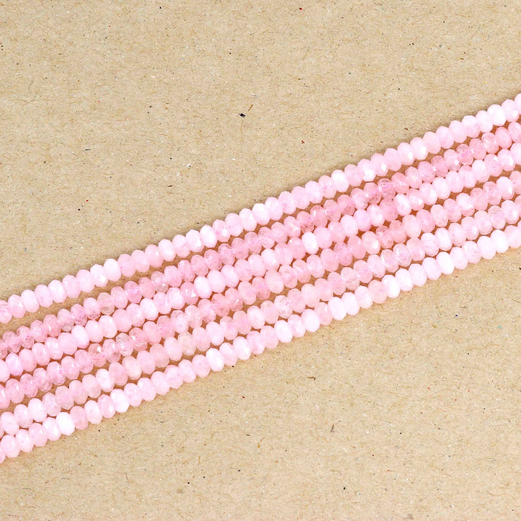 Bild von Rosenquarz fac. Button  4mm Strang Extra