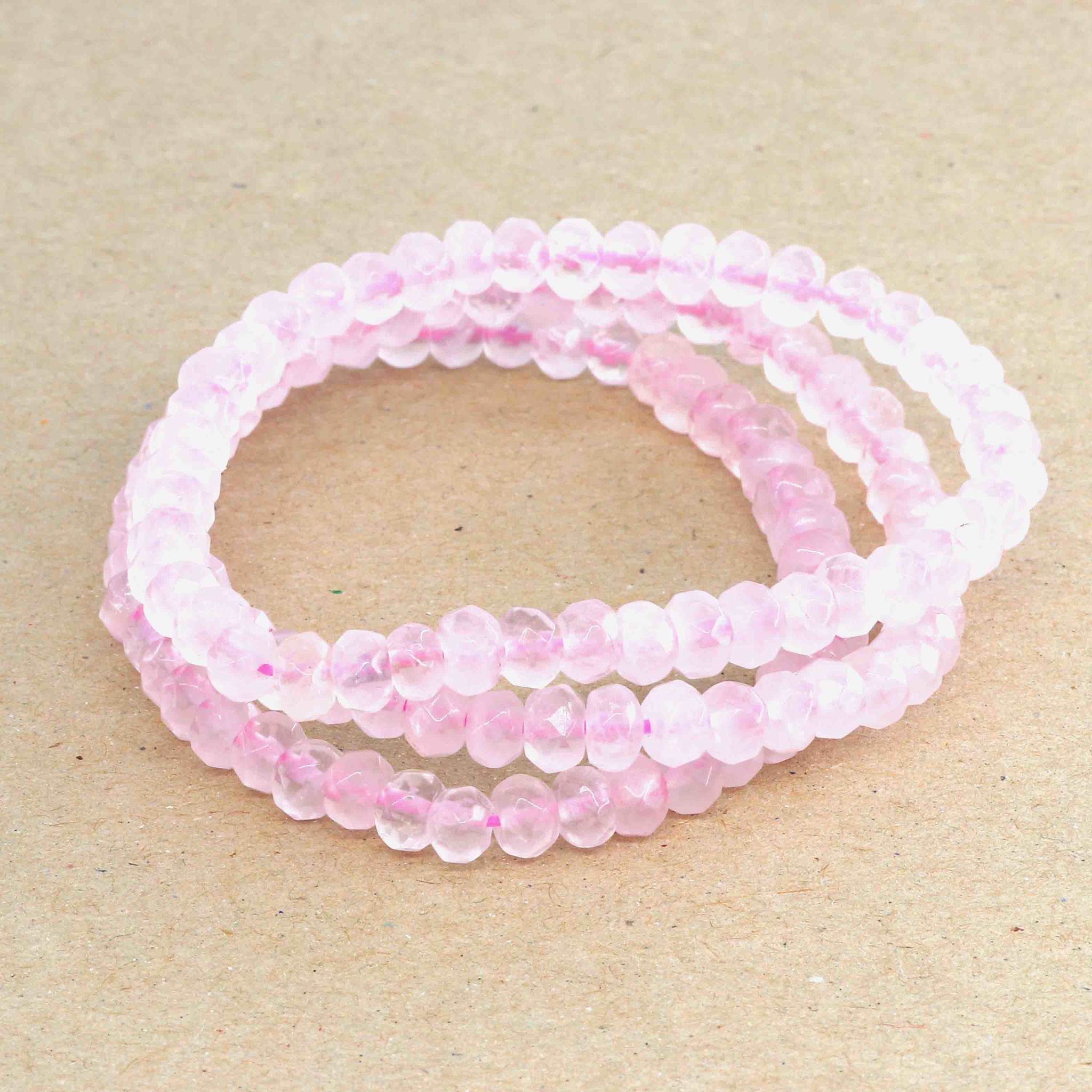 Bild von Rosenquarz fac. Button  6mm Armband