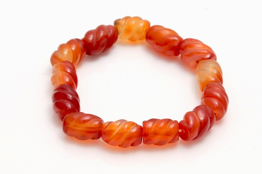 Karneol Walze gewellt 15x11mm Armband